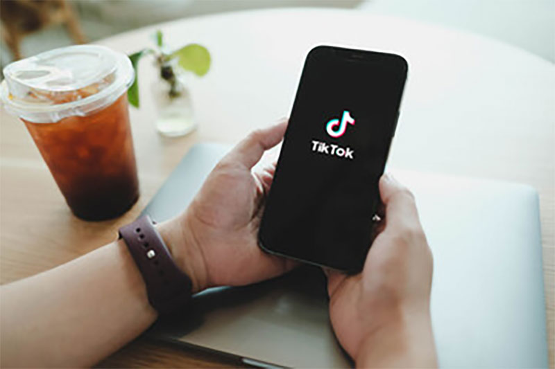 Person Browsing Tiktok