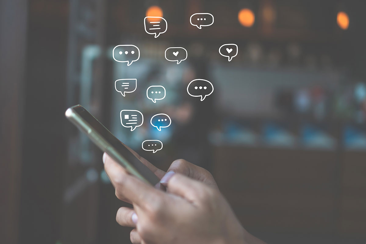 Women hand using smartphone typing